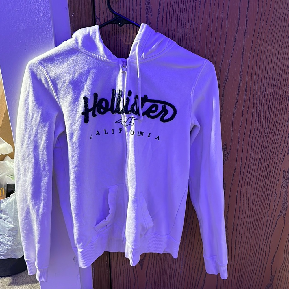 This is a zip up that’s white super cute